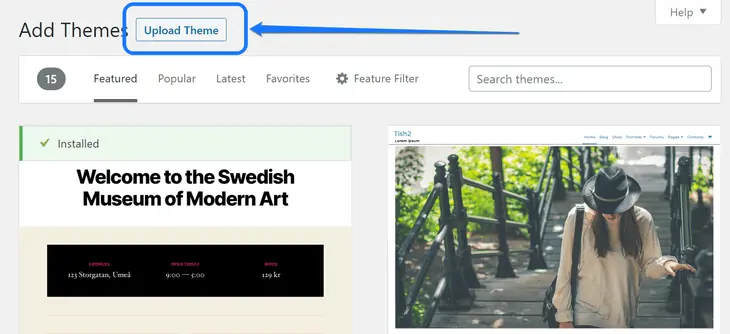 Apontando para o botão Carregar Tema acima da página Adicionar Temas no WordPress